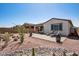 Backyard featuring patio, desert landscaping, and lounge chairs at 12538 E Pivot Peak --, Gold Canyon, AZ 85118