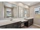 Bathroom featuring double sinks, modern fixtures, and wood look flooring at 12538 E Pivot Peak --, Gold Canyon, AZ 85118