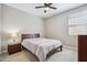 Bedroom featuring a queen bed, ceiling fan, and bedside table at 12538 E Pivot Peak --, Gold Canyon, AZ 85118