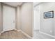 Bright entryway with wood-look tile flooring and a white front door at 12538 E Pivot Peak --, Gold Canyon, AZ 85118