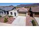 Exterior home view showcasing desert landscaping, front yard, and a two-car attached garage at 12538 E Pivot Peak --, Gold Canyon, AZ 85118