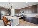 Modern kitchen featuring stainless appliances, white subway tiles, and a large center island at 12538 E Pivot Peak --, Gold Canyon, AZ 85118