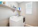 Bright laundry room featuring modern washer and dryer units at 12538 E Pivot Peak --, Gold Canyon, AZ 85118