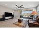 Open living room with large windows and sliding doors, and a ceiling fan at 12538 E Pivot Peak --, Gold Canyon, AZ 85118