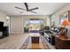 Spacious living room with large sliding glass doors leading to an outdoor patio with desert views at 12538 E Pivot Peak --, Gold Canyon, AZ 85118