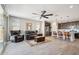 Open-concept living room and kitchen features modern appliances, a ceiling fan, and light flooring at 12538 E Pivot Peak --, Gold Canyon, AZ 85118