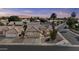 Aerial shot of home featuring desert landscaping, a tiled roof, and a well-maintained yard at 1413 E San Remo Ave, Gilbert, AZ 85234