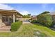 Well-maintained backyard with pool, patio, privacy landscaping, and ample green space at 1413 E San Remo Ave, Gilbert, AZ 85234