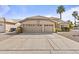 Charming home featuring a two-car garage, desert landscaping, and spacious driveway at 1413 E San Remo Ave, Gilbert, AZ 85234