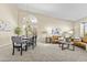 Open-concept living and dining area with high ceilings, large window, and comfortable seating arrangement at 1413 E San Remo Ave, Gilbert, AZ 85234