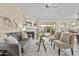 Bright living room with a cozy fireplace, comfortable seating, and seamless access to the patio at 1413 E San Remo Ave, Gilbert, AZ 85234