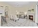 Open-concept living area with fireplace, lots of natural light, and easy access to the kitchen at 1413 E San Remo Ave, Gilbert, AZ 85234