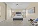 Carpeted bedroom featuring two windows, a ceiling fan, and neutral paint at 1413 E San Remo Ave, Gilbert, AZ 85234