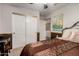 Comfortable bedroom featuring a closet and neutral decor with an attached desk at 14228 W Weldon Ave, Goodyear, AZ 85395