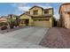 Attractive home with a clean driveway and charming curb appeal in a quiet neighborhood at 14228 W Weldon Ave, Goodyear, AZ 85395