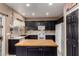 Bright kitchen with an island, white appliances, and ample cabinet space at 14228 W Weldon Ave, Goodyear, AZ 85395