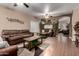 Spacious living room featuring hardwood floors, comfortable seating, and natural lighting at 14228 W Weldon Ave, Goodyear, AZ 85395