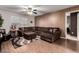 Spacious living room featuring a sectional sofa, stylish rug, and modern accents at 14228 W Weldon Ave, Goodyear, AZ 85395