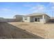An unfinished backyard offering a blank canvas for your outdoor oasis at 1423 S 239Th Dr, Buckeye, AZ 85326