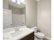 Well-lit bathroom featuring a modern vanity, sink, toilet and shower at 1423 S 239Th Dr, Buckeye, AZ 85326