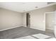 Spacious carpeted bedroom with ample natural light and walk-in closet access at 1423 S 239Th Dr, Buckeye, AZ 85326