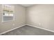 Neutral bedroom with a window and carpet flooring is ready for customization at 1423 S 239Th Dr, Buckeye, AZ 85326