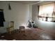 Bedroom with hardwood floors and natural light needs decluttering to showcase its potential as a cozy retreat at 14627 N 33Rd Ave, Phoenix, AZ 85053