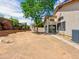 Large backyard with desert landscaping, tree, block wall, and view of the back of the home at 17210 N Cassi Dr, Surprise, AZ 85374