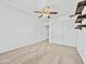 Spacious bedroom features neutral carpeting, a ceiling fan and closet at 17210 N Cassi Dr, Surprise, AZ 85374