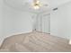 Cozy bedroom features neutral carpet, white walls, and an open closet at 17210 N Cassi Dr, Surprise, AZ 85374