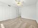 Comfortable bedroom with plush carpet, white walls, and a view to the hall at 17210 N Cassi Dr, Surprise, AZ 85374
