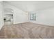 Bright and airy living room with carpet flooring and neutral paint scheme at 17210 N Cassi Dr, Surprise, AZ 85374