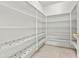 Spacious pantry features ample white shelving with decorative accent tiles at 17210 N Cassi Dr, Surprise, AZ 85374