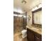 Bathroom featuring a glass-enclosed shower, decorative tile work, and granite countertops at 18907 N 92Nd Way, Scottsdale, AZ 85255