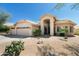 Charming single-story home featuring a three-car garage and low maintenance desert landscaping at 18907 N 92Nd Way, Scottsdale, AZ 85255