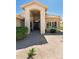 Inviting single-story home with covered entry, desert landscaping, and tiled roof at 18907 N 92Nd Way, Scottsdale, AZ 85255