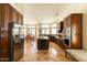 Open concept kitchen features a large island, stainless appliances, and tiled flooring at 18907 N 92Nd Way, Scottsdale, AZ 85255