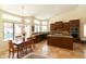 Spacious kitchen with island and dining area, featuring wood cabinets and views of the pool at 18907 N 92Nd Way, Scottsdale, AZ 85255