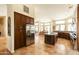 Open kitchen with stainless steel appliances, custom cabinets, a spacious island, and large windows at 18907 N 92Nd Way, Scottsdale, AZ 85255