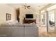 Comfortable living room featuring sectional sofa, large TV, and access to outdoor living space at 18907 N 92Nd Way, Scottsdale, AZ 85255
