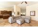 Spacious living area featuring a comfortable sectional sofa, tan tile flooring, and ample natural light at 18907 N 92Nd Way, Scottsdale, AZ 85255
