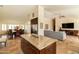 Open floor plan featuring granite island, stainless steel appliances, and view to dining and living area at 18907 N 92Nd Way, Scottsdale, AZ 85255