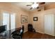 Office space featuring a desk, custom paint, window with plantation shutters, and hardwood floors at 18907 N 92Nd Way, Scottsdale, AZ 85255