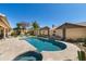 Sparkling private pool and spa with travertine tile surround and decorative wall features at 18907 N 92Nd Way, Scottsdale, AZ 85255