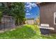 Well maintained backyard with shed, aviary, and mature landscaping at 1907 E Huber St, Mesa, AZ 85203