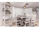 Charming dining area with built-in shelving, bright natural light, and seating for six around the table at 1907 E Huber St, Mesa, AZ 85203