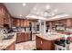 Spacious kitchen with stainless steel appliances, granite countertops, and ample cabinet space at 1907 E Huber St, Mesa, AZ 85203