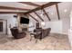 Inviting living room boasts vaulted ceilings, stone fireplace, tile floors, and comfortable seating at 1907 E Huber St, Mesa, AZ 85203