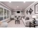 Cozy living room featuring recessed lighting, hardwood floors, a stylish sofa, and charming decor at 1907 E Huber St, Mesa, AZ 85203