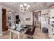 Home office featuring a neutral color palette, desk, chair and unique ceiling design at 1907 E Huber St, Mesa, AZ 85203